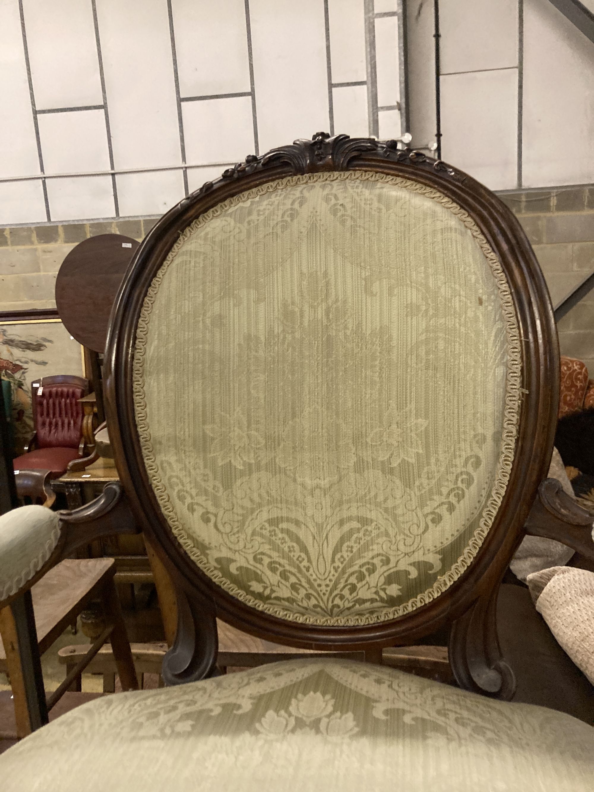 A Victorian upholstered walnut salon chair, width 63cm, depth 50cm, height 100cm